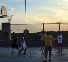 Shooting hoops at sunset.