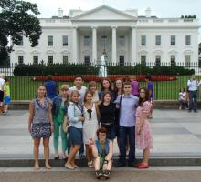 Participants pose in front of the White House in Washington D.C.