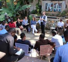 Chris Merrill introduces our program at the Haiti PEN Center.jpg