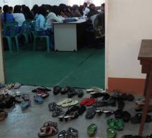21-Students shoes outside the classroom at Dagon University.jpg