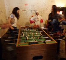 Participants playing a game of foosball. 