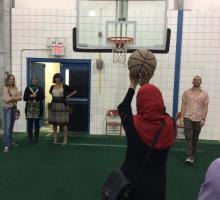 Participants play basketball at a local mosque.