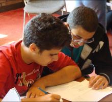 Students study poetry in Arabic and English.