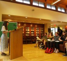 Students give a reading at the Dey House, home to the Writers' Workshop.