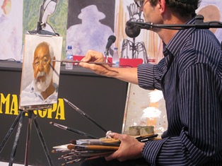 A man is painting a small portrait of another man