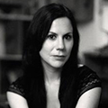 A black and white photo of Jennifer Foerster looking into the camera.