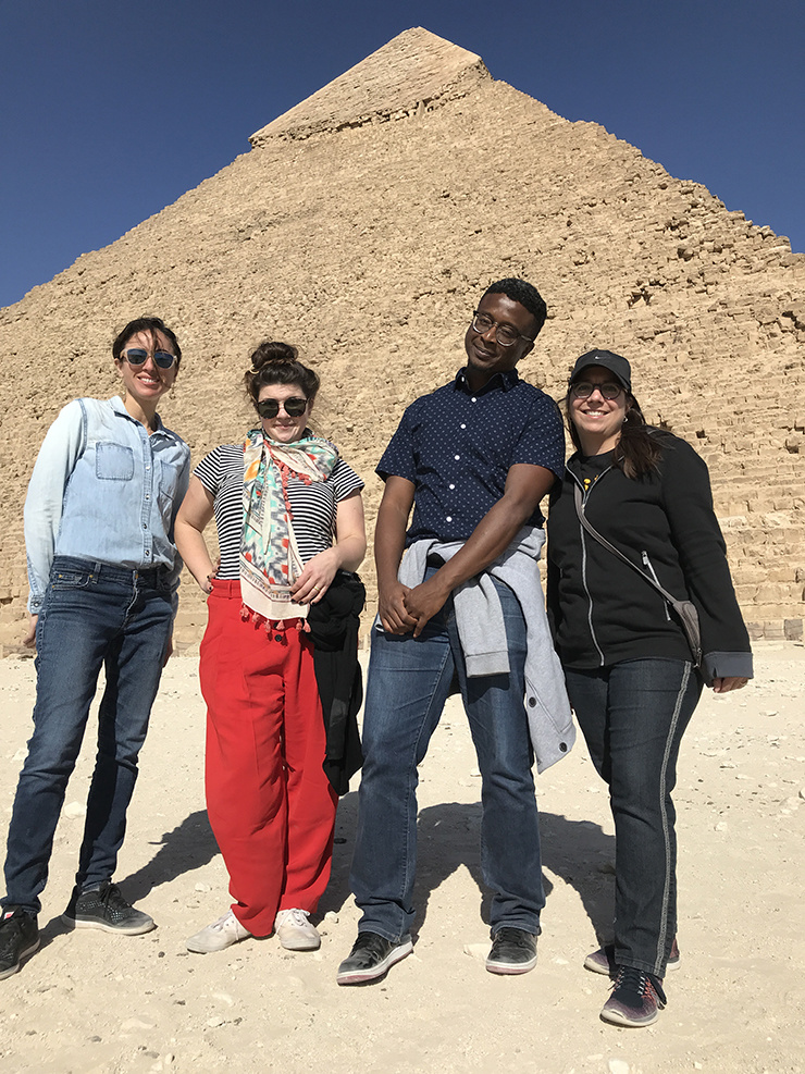 Zaina Arafat, Caite Dolan-Leach, Douglas Manuel, & Kelly Bedeian standing in front of an Egyptian pyramid