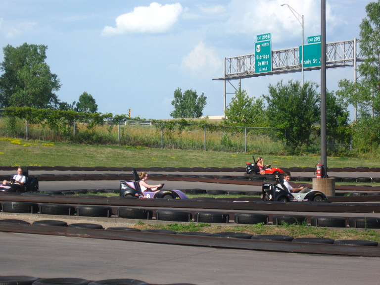 A group of Between the Lines participants race go karts at Michael's Fun World in Davenport, Iowa.