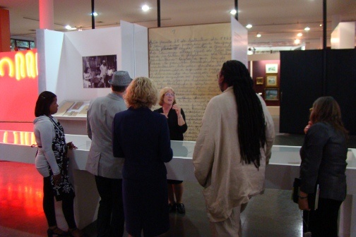 A group of people look at an exhibit in the Museu Afro Brasil.