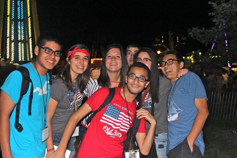 A group of Between the Lines participants pose for a photo on the Fourth of July.