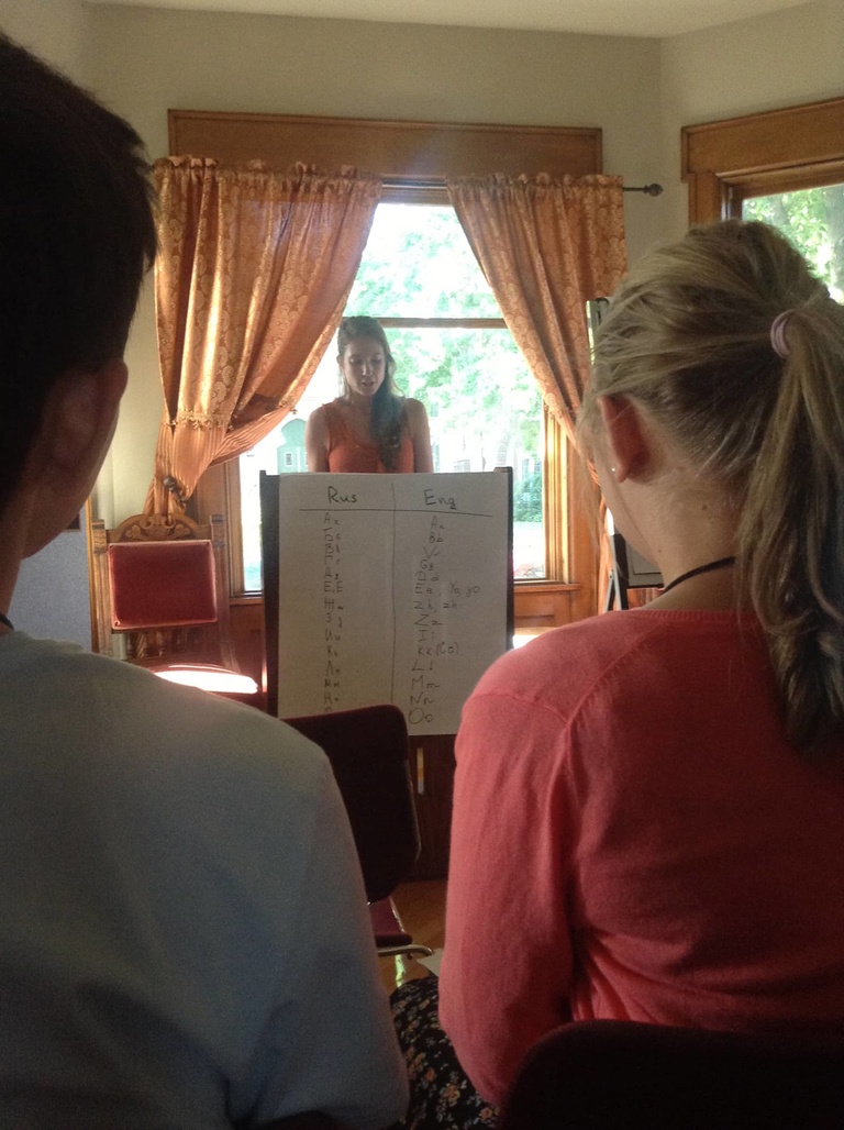 Between the Lines participant Catherine does a reading before others at Shambaugh House