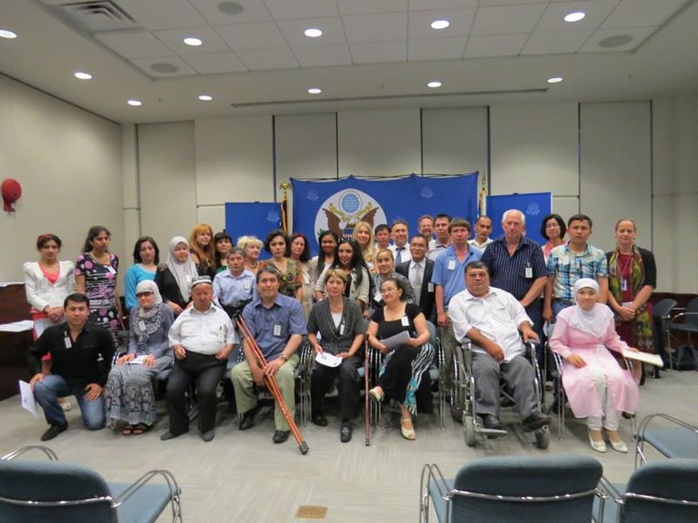 Group of folks representing the disabled community in Uzbekistan pose for a photo.