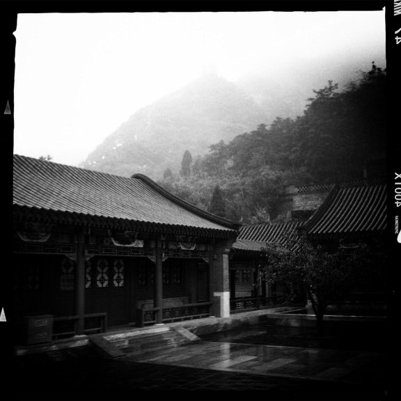 Part of the museum complext at Juyongguan. The Great Wall is visible as a pale line ascending the hillside in the upper-left. 