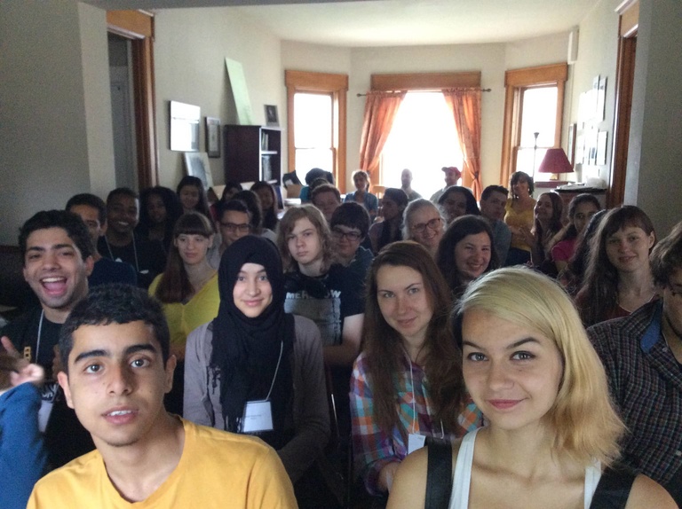 A group of Between the Lines Participants pose for a phot at their daily morning meeting.