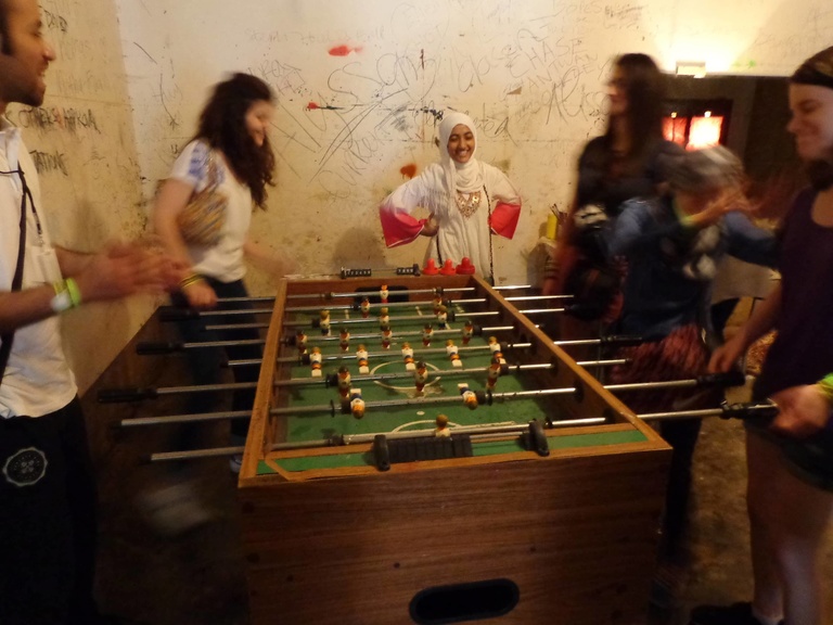 Between the Lines participants play foosball together.