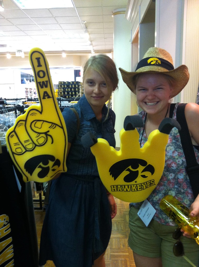 Two Between the Lines participants pose with Iowa merchandise.