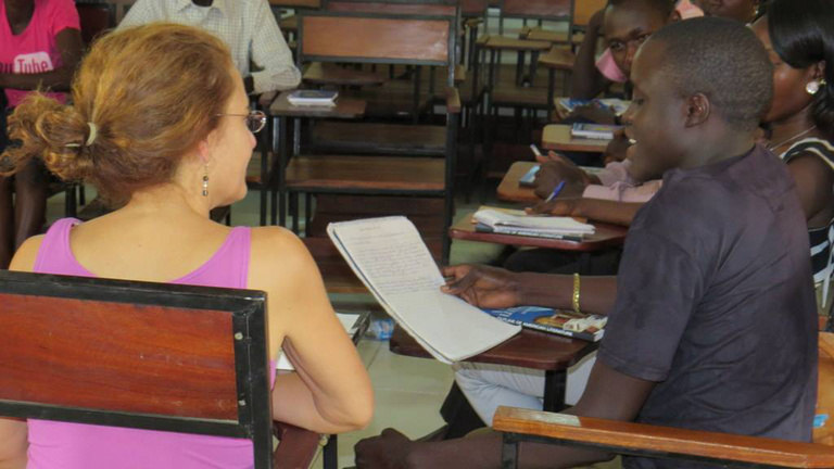 A student shares his work during a writing workshop with Catherine Filloux.