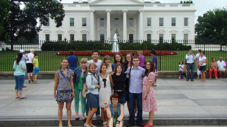 A group of Between the Lines participants pose in front of the White House.