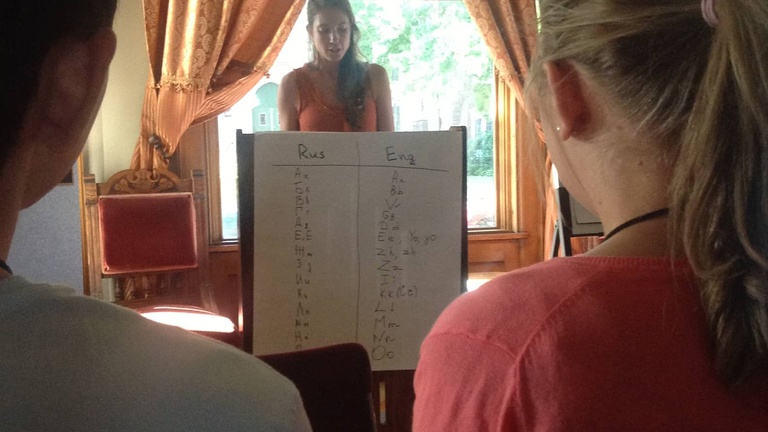 Between the Lines participant Catherine does a reading before others at Shambaugh House